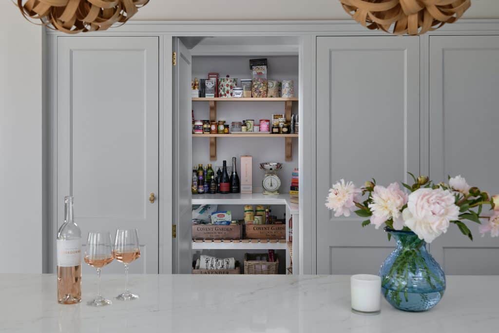 Grey painted shaker kitchen secret door with walk in pantry