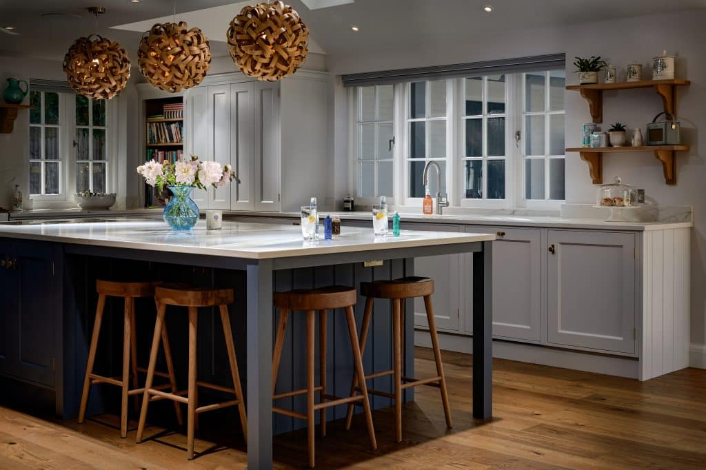 Gin cocktail with Donwpour gin and Fevertree Tonic in blue painted Rencraft shaker kitchen