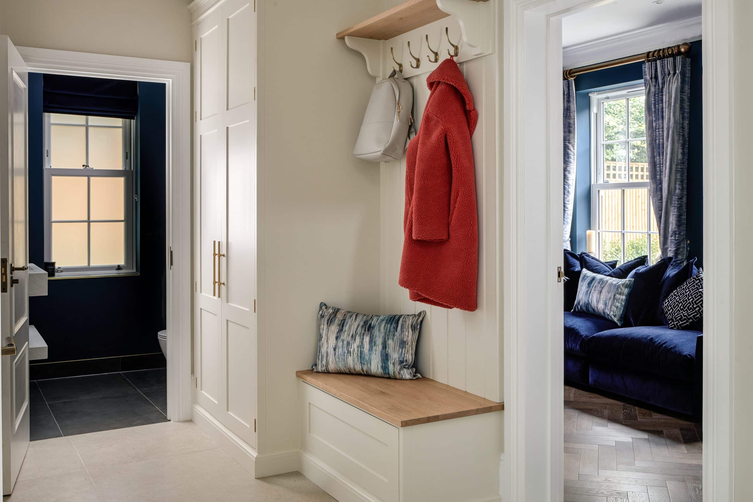 Handmade bespoke hallway bench with boot room style pegs for coats