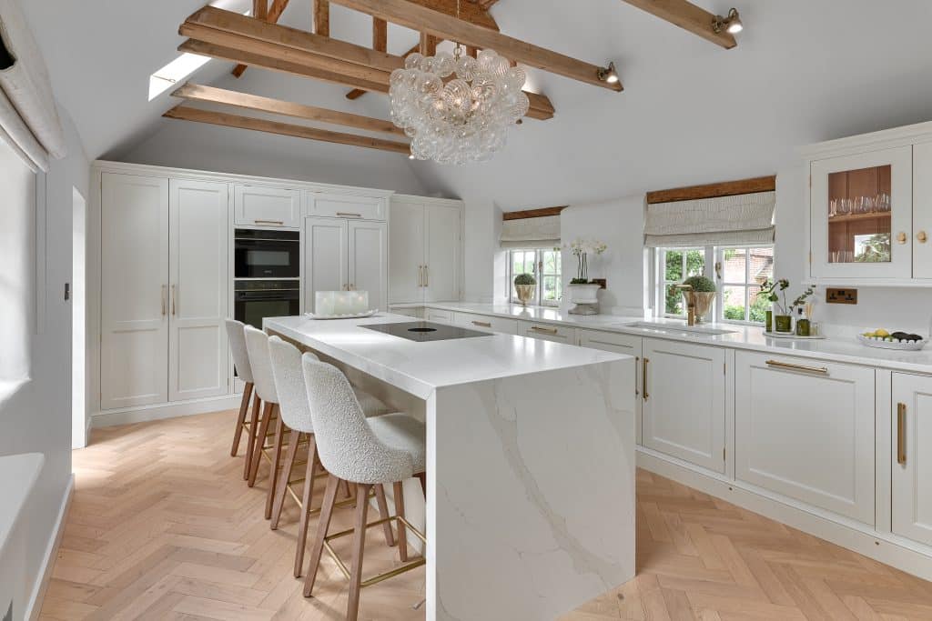Handmade bespoke white Shaker kitchen with kitchen island with seating in Kent