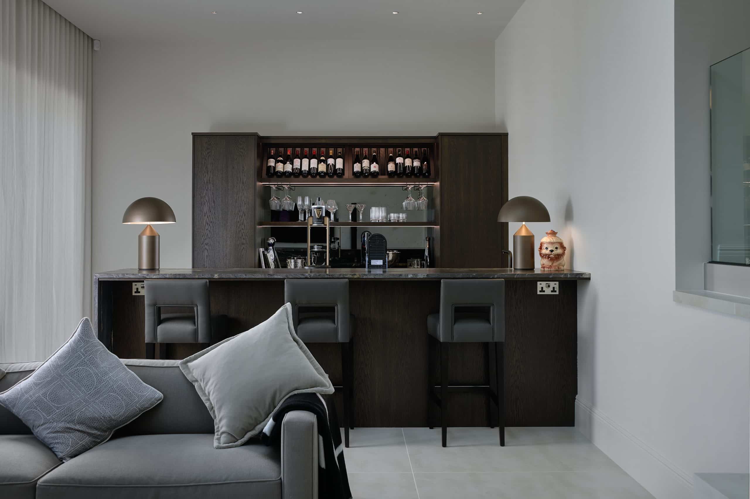 Bespoke bar with integrated appliances and black marble in Kent