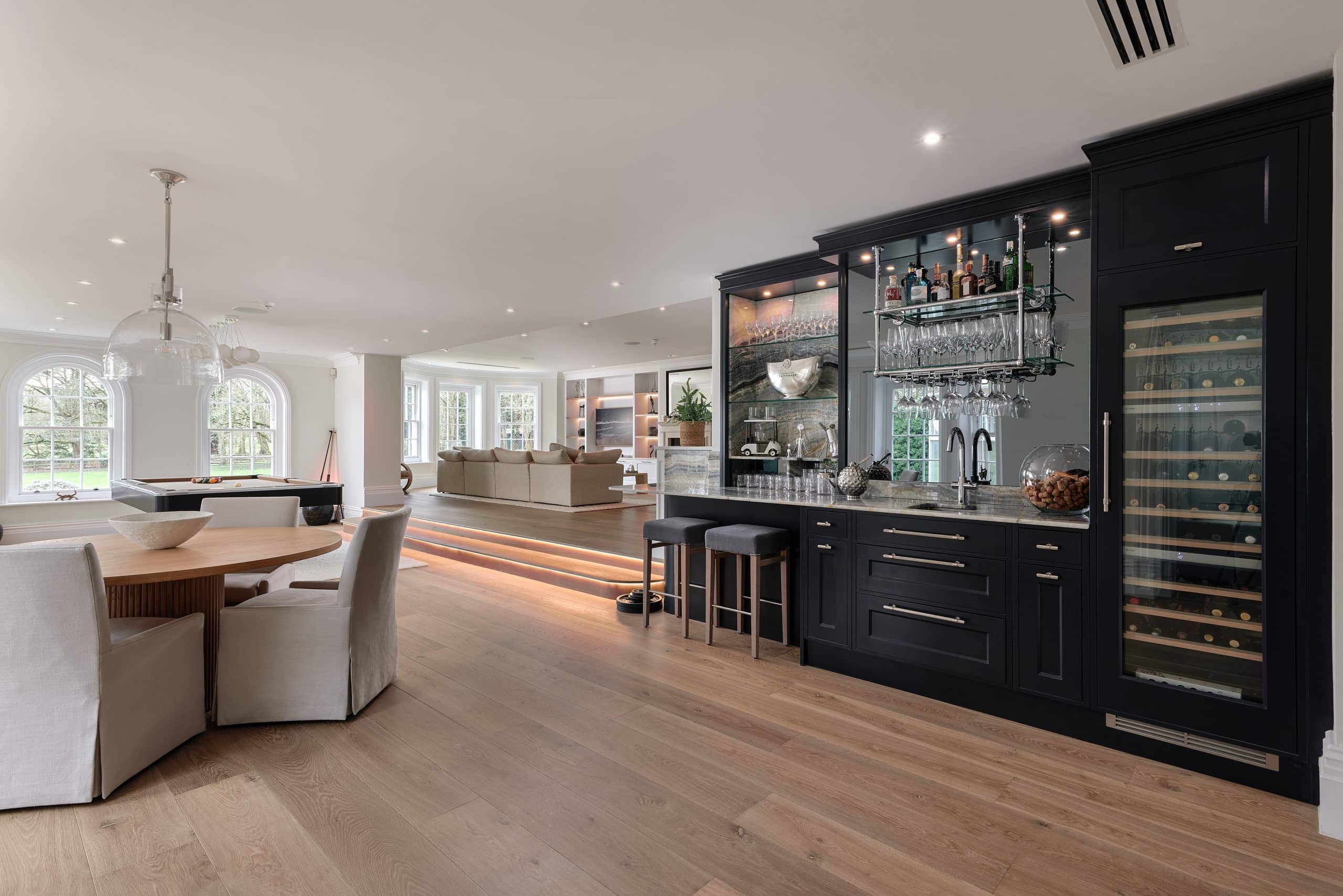 Bespoke cocktail bar with handmade cabinetry and a hand-painted finish