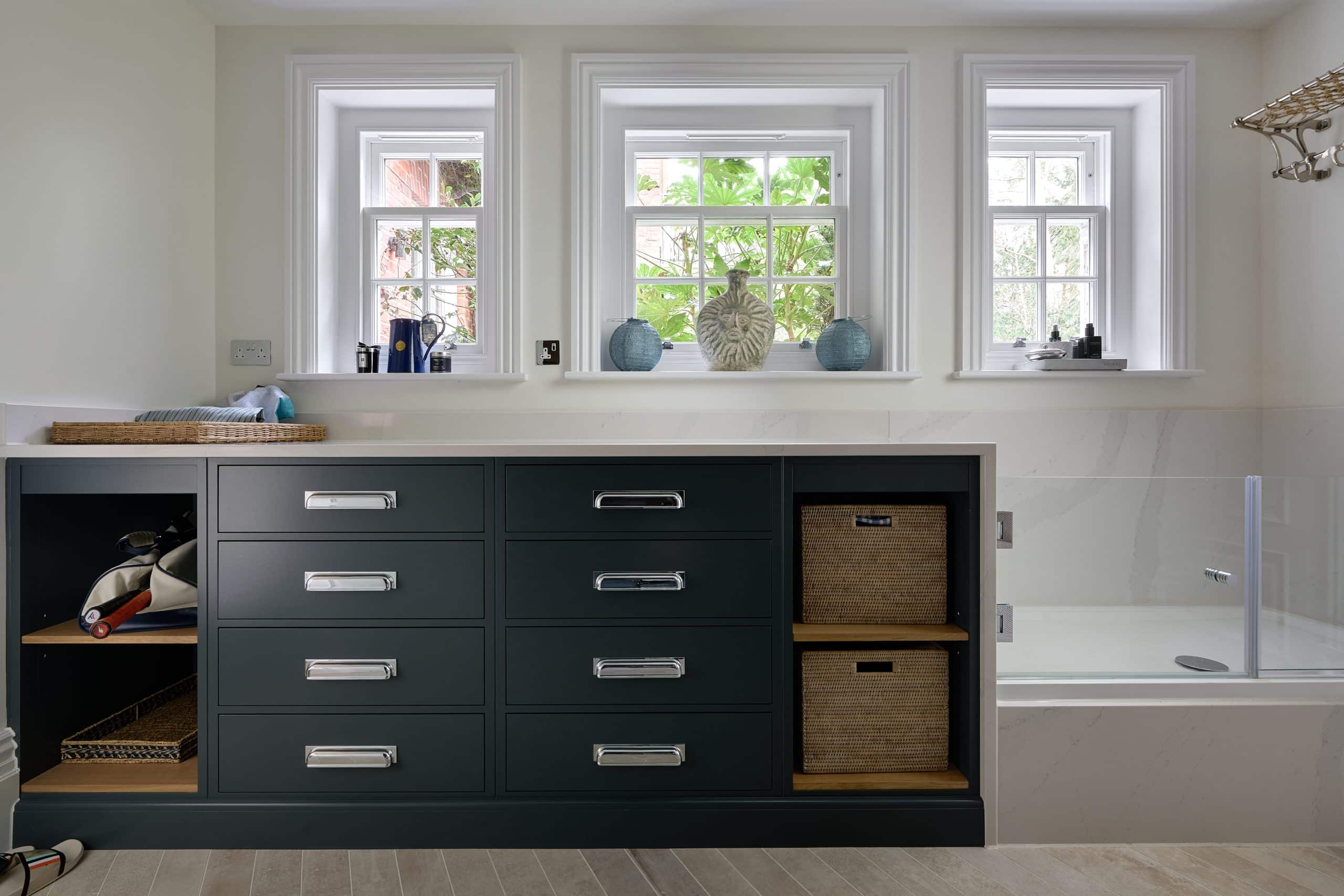 Bespoke luxury boot room with handmade cabinetry and a dog shower